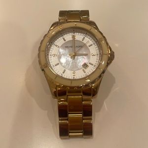 Michael Kors gold watch. Pearl & cream colored face.